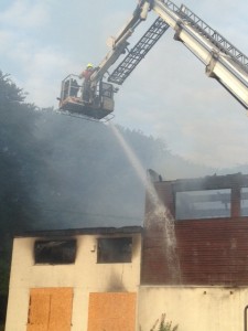 Water jets dousing the blaze at Farnley Sports and Social Club this morning. Photo: West Leeds Dispatch